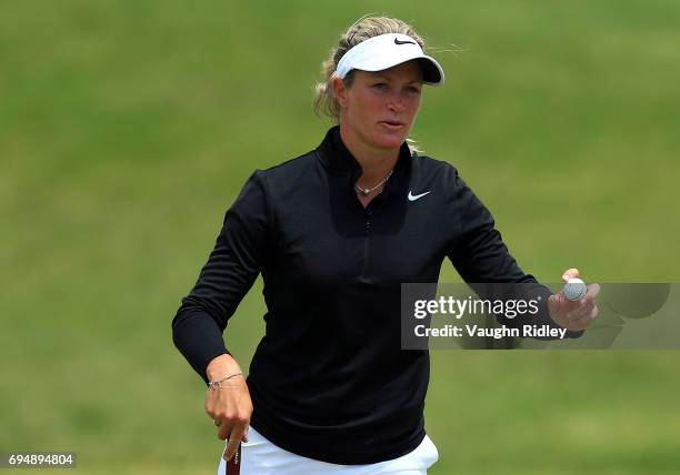 Suzann Pettersen of Norway reacts after sinking her putt on the 1st hole during the final round of the Manulife LPGA Classic at Whistle Bear Golf...