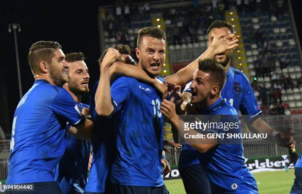Kosovo's Amir Rrahmani celebrates with teammates after scoring during the FIFA World Cup 2018 qualification football match between Kosovo and Turkey...