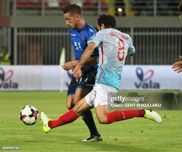 Kosovo's Donis Avdijaj is tackled by Turkey's Selcuk Inan during the FIFA World Cup 2018 qualification football match between Kosovo and Turkey at...