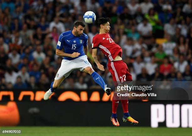 Andrea Barzagli of Italy competes for the ball with Mario Frick of Liechtenstein during the FIFA 2018 World Cup Qualifier between Italy and...
