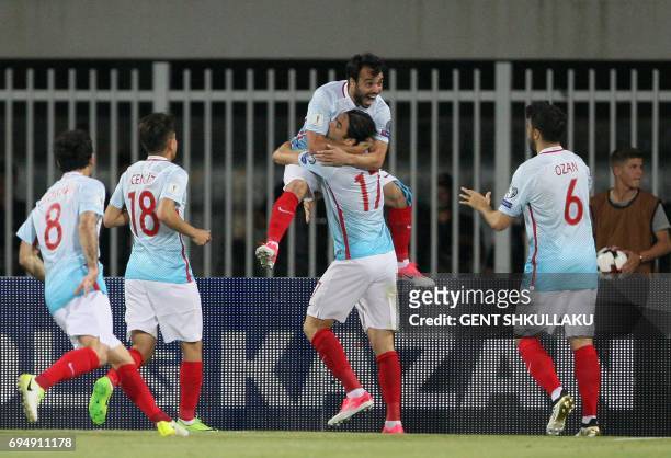 Turkey's Volkan Sen celebrates with teammates including Burak Yilmaz after scoring during the FIFA World Cup 2018 qualification football match...