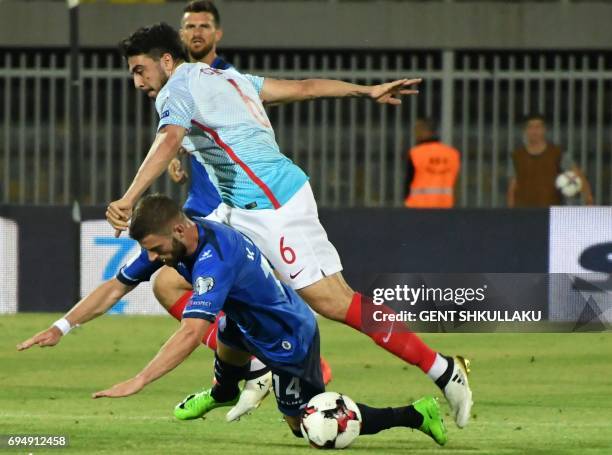 Kosovo's Valon Berisha is tackled by Turkey's Ozan Tufan during the FIFA World Cup 2018 qualification football match between Kosovo and Turkey at...