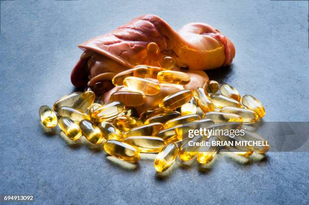 cod liver oil capsules - animal liver foto e immagini stock