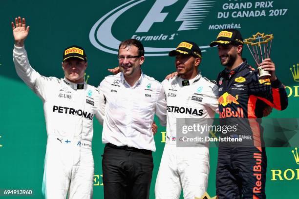 Top three finishers Lewis Hamilton of Great Britain and Mercedes GP Valtteri Bottas of Finland and Mercedes GP and Daniel Ricciardo of Australia and...