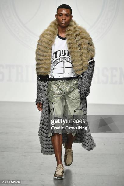 Model walks the runway at the Astrid Andersen Show Spring Summer 2018 fashion show during London Menswear Fashion Week on June 11, 2017 in London,...