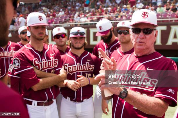 Florida State head coach Mike Martin talks tactics with his team prior to the start of the NCCA Division I Tallahassee Super Regional game between...