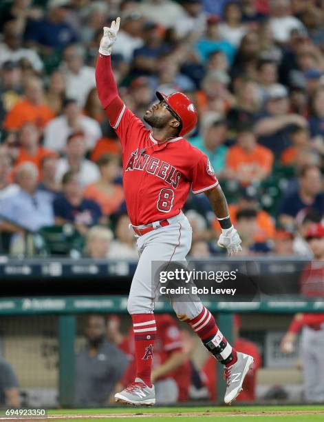 Eric Young Jr. #8 of the Los Angeles Angels of Anaheim celebrates hitting a three-run home run in the fifth inning against the Houston Astros at...