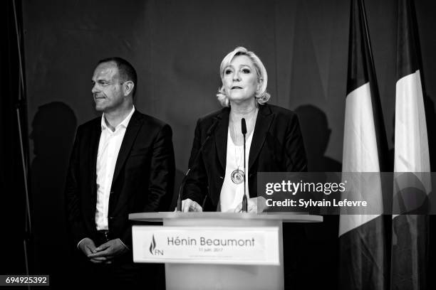 French National Front political party leader and candidate for French legislative elections, Marine Le Pen flanked by mayor of Henin-Beaumont, Steeve...