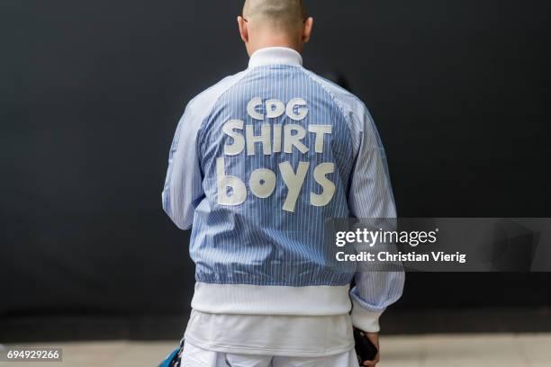 Alessandro Altomare wearing a Comme des Garcons shirt with the print CDG shirt boys during the London Fashion Week Men's June 2017 collections on...