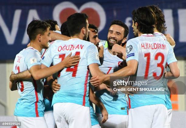 Turkey's players celebrate after scoring during the FIFA World Cup 2018 qualification football match between Kosovo and Turkey in Loro Borici stadium...