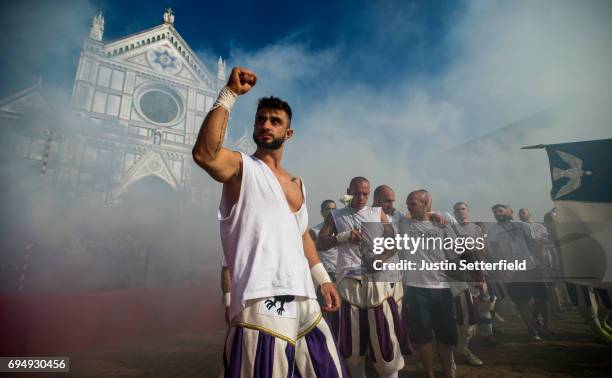 Calcianti of Santo Spirito Bianchi Team enter the arena before playing La Santa Croce Azzurri Team during the semi-final match of the Calcio Storico...