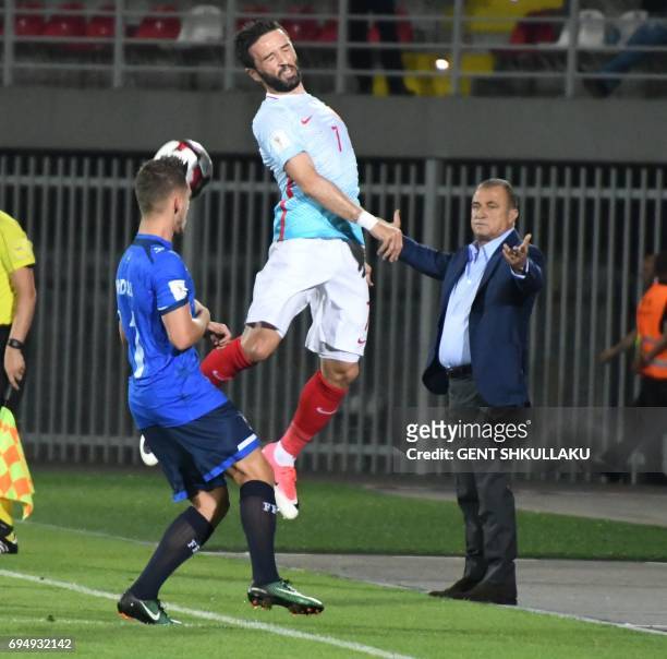 Turkey's head coach Fatih Terim react as Kosovo's Donis Avdijaj vies with Turkey's Gokhan Gonul during the FIFA World Cup 2018 qualification football...