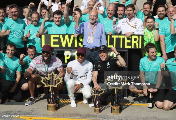 Race winner Lewis Hamilton of Great Britain and Mercedes GP and second place finisher Valtteri Bottas of Finland and Mercedes GP celebrate with their...