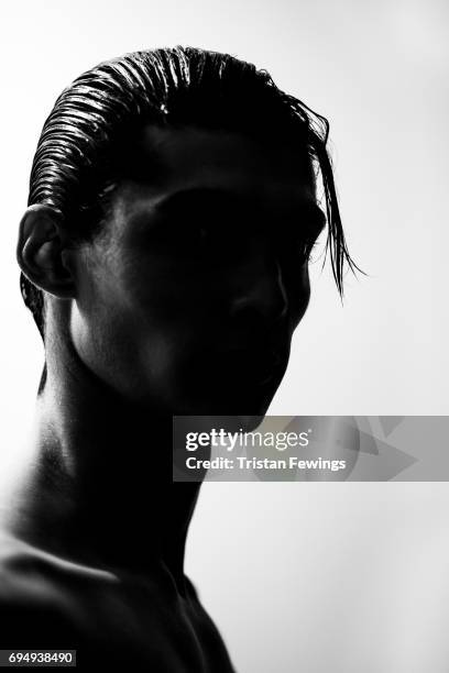 Model backstage ahead of the Alex Mullins show during the London Fashion Week Men's June 2017 collections on June 11, 2017 in London, England.