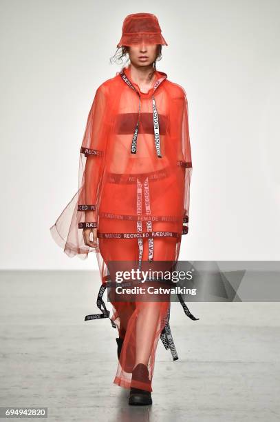 Model walks the runway at the Christopher Raeburn Show Spring Summer 2018 fashion show during London Menswear Fashion Week on June 11, 2017 in...