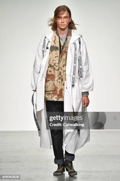 Model walks the runway at the Christopher Raeburn Show Spring Summer 2018 fashion show during London Menswear Fashion Week on June 11, 2017 in...