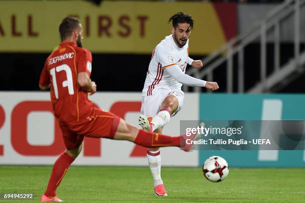 Isco of Spain kicks the ball as Ostoja Stjepanovic od FYR Macedonia tackles during the FIFA 2018 World Cup Qualifier between FYR Macedonia and Spain...