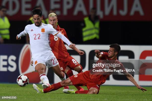 Isco of Spain is challenged by Kristijan Tosevski during the FIFA 2018 World Cup Qualifier between FYR Macedonia and Spain at Nacional Arena Filip II...