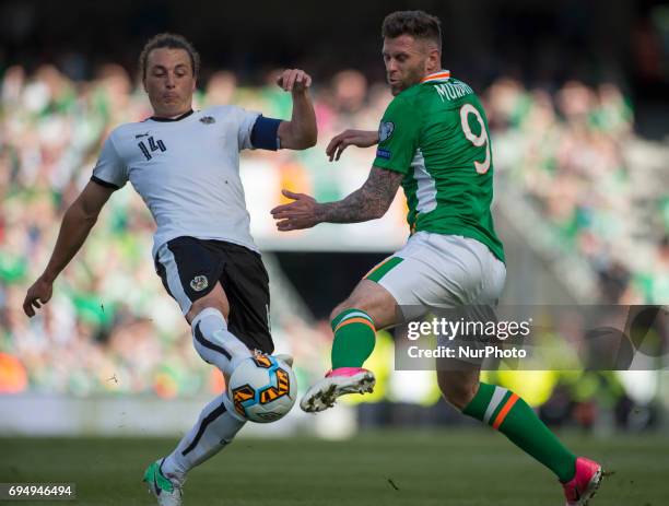 Daryl Murphy of Ireland and Julian Baumgartlinger of Austria fight for the ball during the FIFA World Cup 2018 Qualifying Round Group D match between...