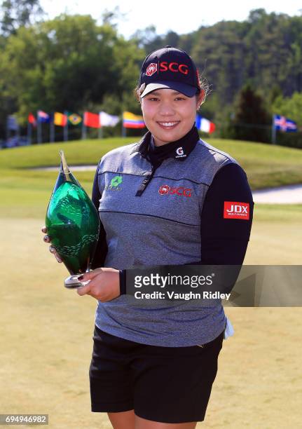Ariya Jutanugarn of Thailand with the trophy after sinking her birdie putt on the 1st playoff hole to win during the final round of the Manulife LPGA...