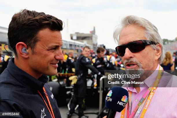 Actor Michael Douglas talks with NBC reported Will Buxton on the grid during the Canadian Formula One Grand Prix at Circuit Gilles Villeneuve on June...