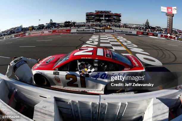 Ryan Blaney, driver of the Motorcraft/Quick Lane Tire & Auto Center Ford, celebrates with the checkered flag after winning the Monster Energy NASCAR...