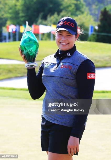 Ariya Jutanugarn of Thailand with the trophy after sinking her birdie putt on the 1st playoff hole to win during the final round of the Manulife LPGA...