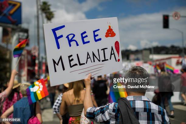 Man carries a sign referencing First Lady Melania Trump at the #ResistMarch during the 47th annual LA Pride Festival on June 11 in the Hollywood...