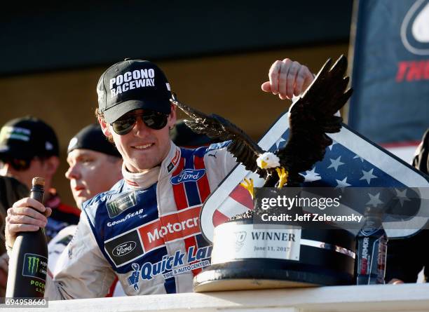 Ryan Blaney, driver of the Motorcraft/Quick Lane Tire & Auto Center Ford, celebrates in Victory Lane after winning the Monster Energy NASCAR Cup...