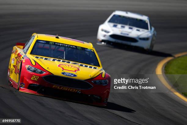 Dale Earnhardt Jr., driver of the Axalta Chevrolet, leads Brad Keselowski, driver of the Miller Lite Ford, during the Monster Energy NASCAR Cup...