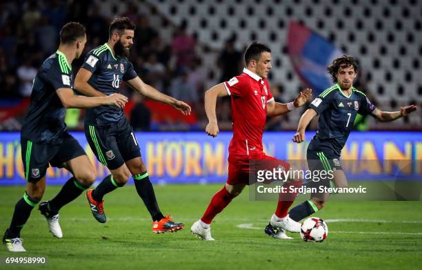 Filip Kostic of Serbia in action against Joe Allen and Joe Ladley of Wales during the FIFA 2018 World Cup Qualifier between Serbia and Wales at...