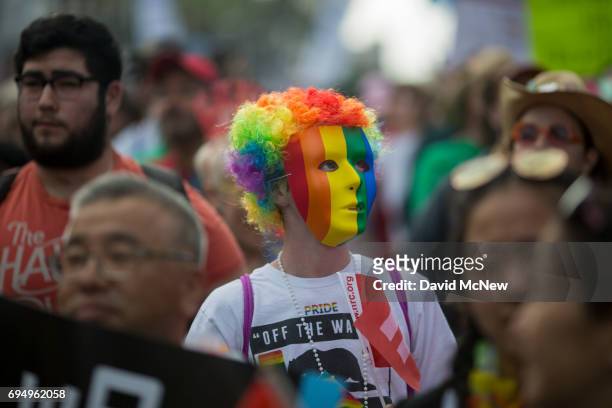 People participate in the #ResistMarch during the 47th annual LA Pride Festival on June 11 in the Hollywood section of Los Angeles and West...