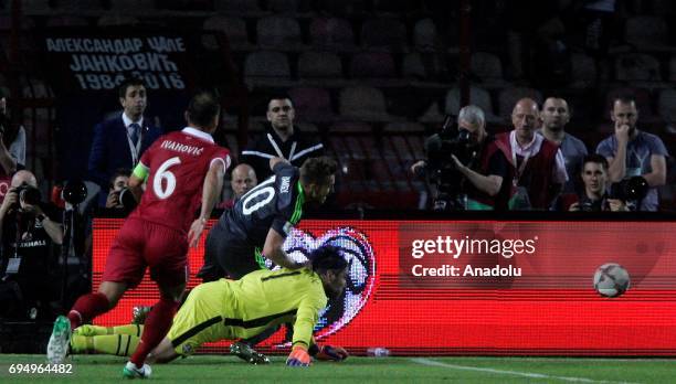 Aaron Ramsey of Wales is in action against Branislav Ivanovic of Serbia during the FIFA 2018 World Cup Qualifier between Serbia and Wales at stadium...