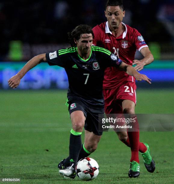 Joe Allen of Wales is in action against Nemanja Milunovic of Serbia during the FIFA 2018 World Cup Qualifier between Serbia and Wales at stadium...