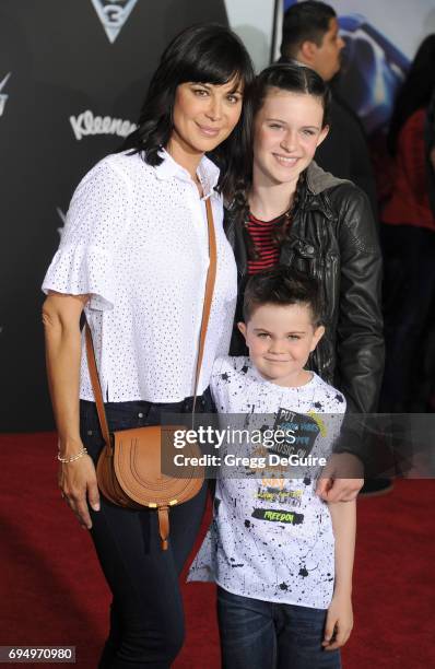 Actress Catherine Bell, children Gemma Beason and Ronan Beason arrive at the premiere of Disney And Pixar's "Cars 3" at Anaheim Convention Center on...