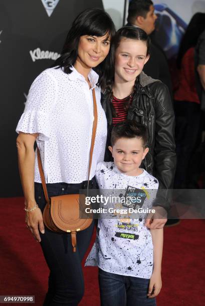 Actress Catherine Bell, children Gemma Beason and Ronan Beason arrive at the premiere of Disney And Pixar's "Cars 3" at Anaheim Convention Center on...