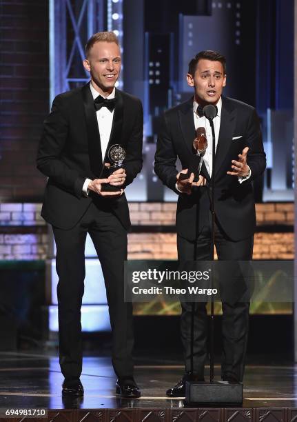 Benj Pasek and Justin Paul accept the award for Best Original Score Written for the Theatre for Dear Evan Hansen onstage during the 2017 Tony...