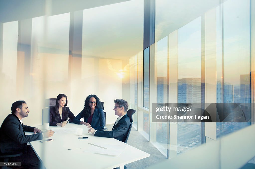 Business colleagues talking in meeting room