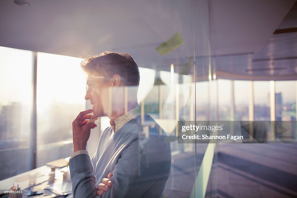 Man standing with ideas in planning office room