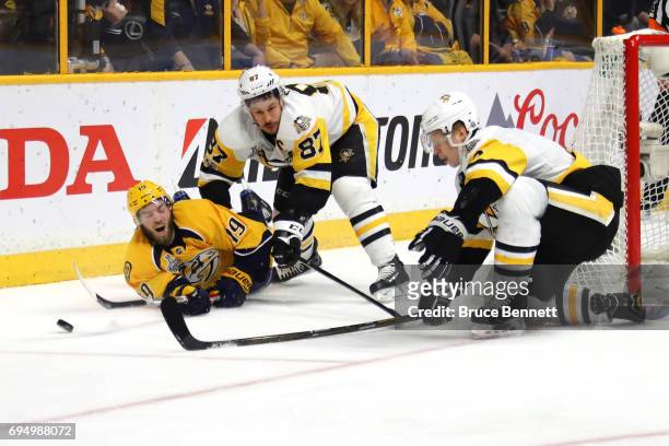 Calle Jarnkrok of the Nashville Predators battles with Sidney Crosby and Olli Maatta of the Pittsburgh Penguins during the second period in Game Six...