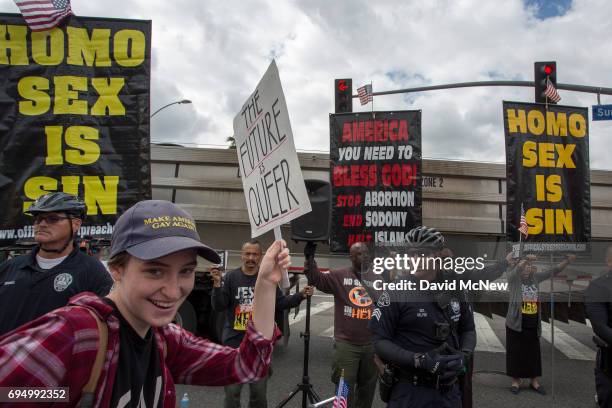 Marchers react to hateful speech from provocative street preachers at the #ResistMarch during the 47th annual LA Pride Festival on June 11 in the...