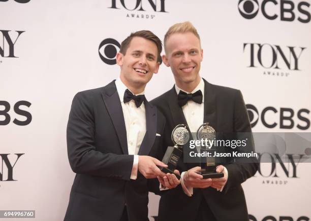 Benj Pasek and Justin Paul, winners of the award for Best Score for Dear Evan Hansen, pose in the press room during the 2017 Tony Awards at 3 West...