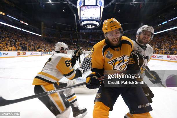 Conor Sheary and Sidney Crosby of the Pittsburgh Penguins defend Calle Jarnkrok of the Nashville Predators during the third period in Game Six of the...