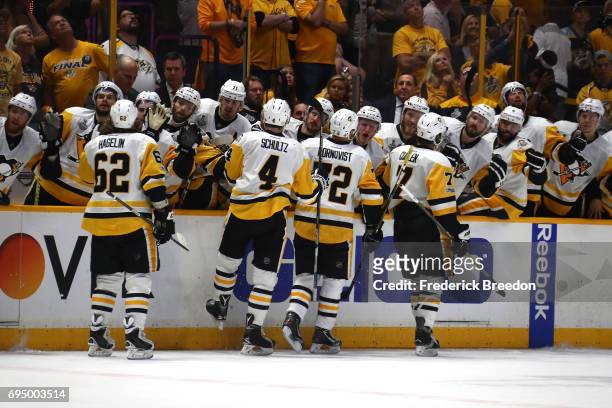 Patric Hornqvist of the Pittsburgh Penguins high fives teammates after scoring a goal against the Nashville Predators during the third period in Game...
