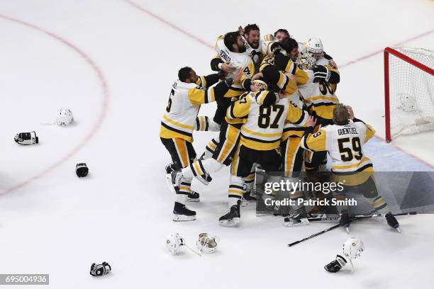 Matt Murray of the Pittsburgh Penguins celebrates with teammates after they defeated the Nashville Predators 2-0 to win the 2017 NHL Stanley Cup...