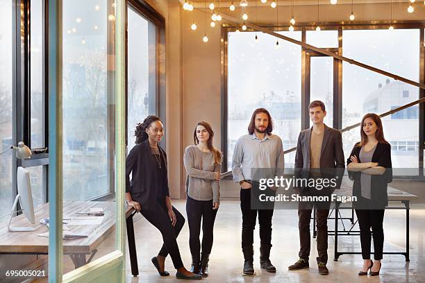 portrait of colleagues in design studio office - geschäftskleidung stock-fotos und bilder
