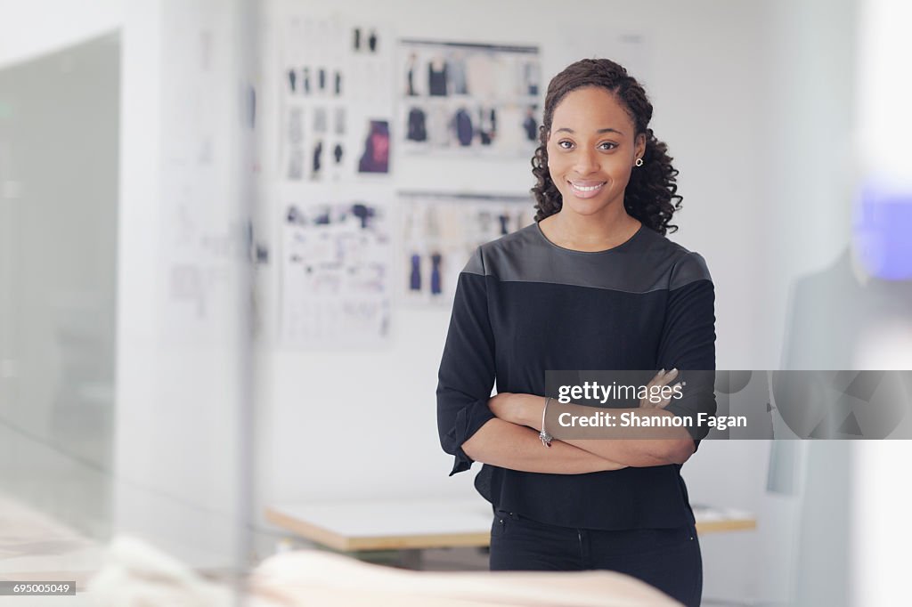 Portrait of woman in fashion design studio