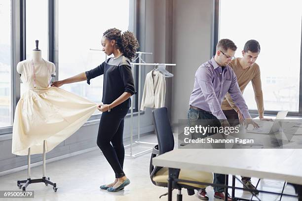 colleagues working in fashion design studio office - design studio woman chinese laptop fotografías e imágenes de stock