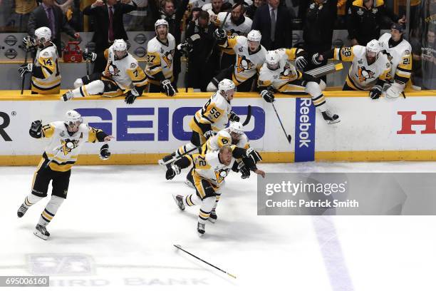 Patric Hornqvist and the bench of the Pittsburgh Penguins celebrate after defeating the Nashville Predators 2-0 to win the 2017 NHL Stanley Cup Final...