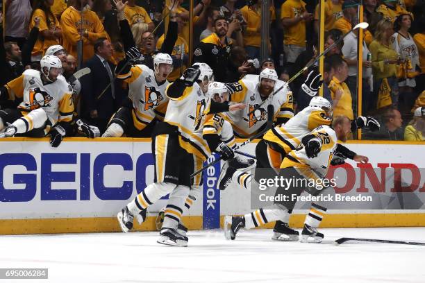 Patric Hornqvist and the bench of the Pittsburgh Penguins celebrate after defeating the Nashville Predators 2-0 to win the 2017 NHL Stanley Cup Final...